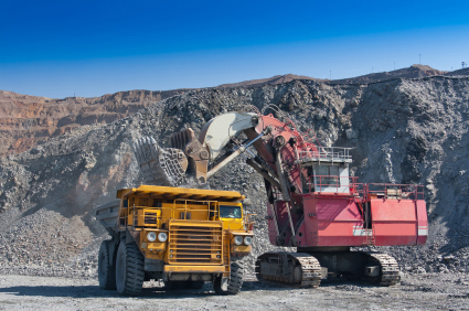 Loading the gold ore into heavy dump truck at the opencast mining